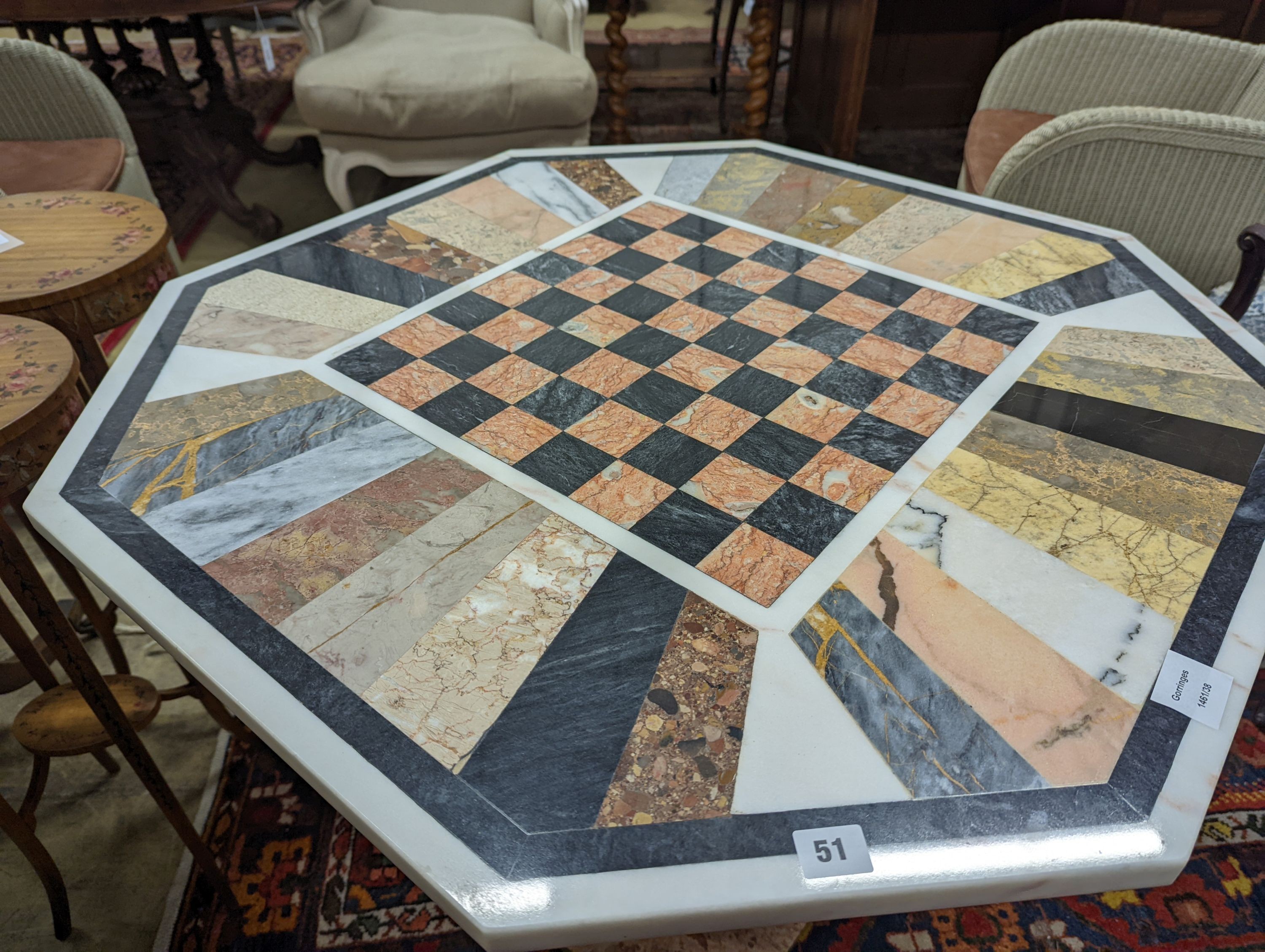 A modern octagonal specimen marble games table, width 91cm, depth 78cm